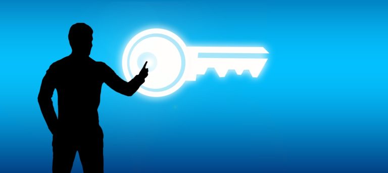 Man standing in front of a screen with a key