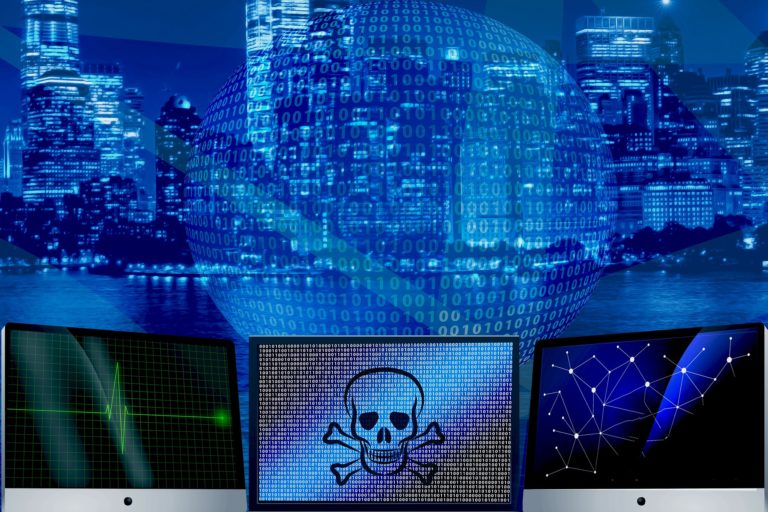 three computer monitors, one with skull and crossbones, in front of binary globe with a large city in background