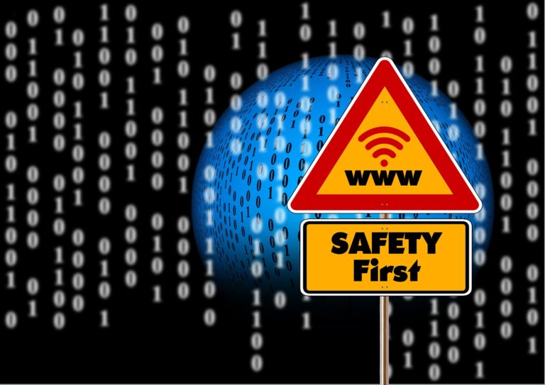 Traffic sign showing "WWW" signal and "Safety First"