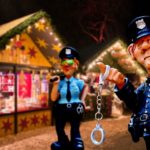 Claymation police officers in front of a Christmas shop