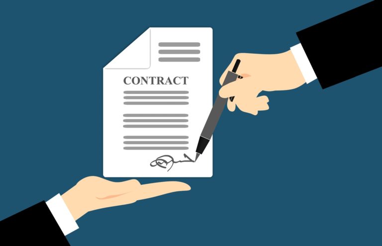 image of a contract being signed