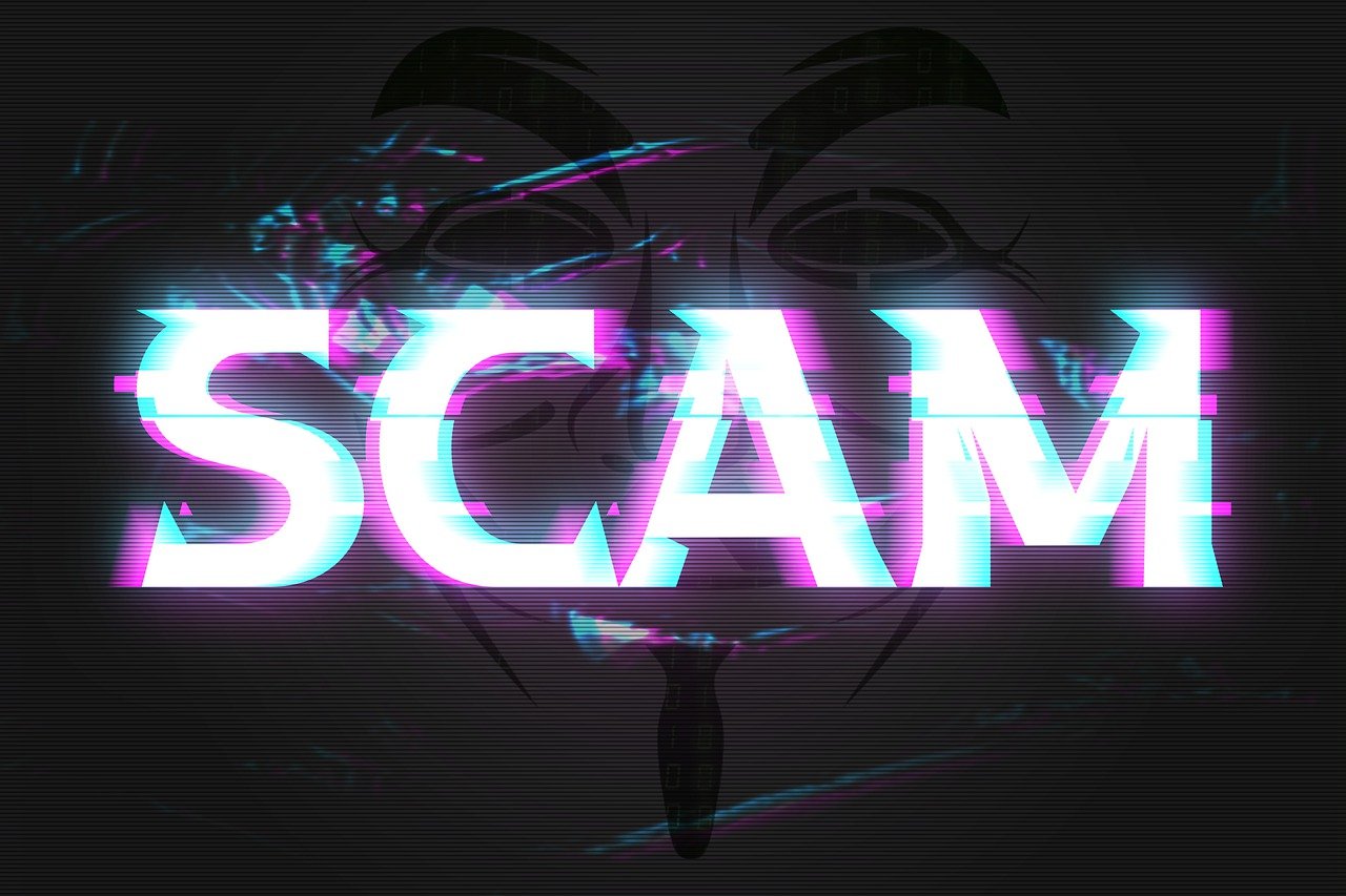 Black background with "SCAM" written in large white letters