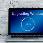 Laptop showing Windows is being upgraded